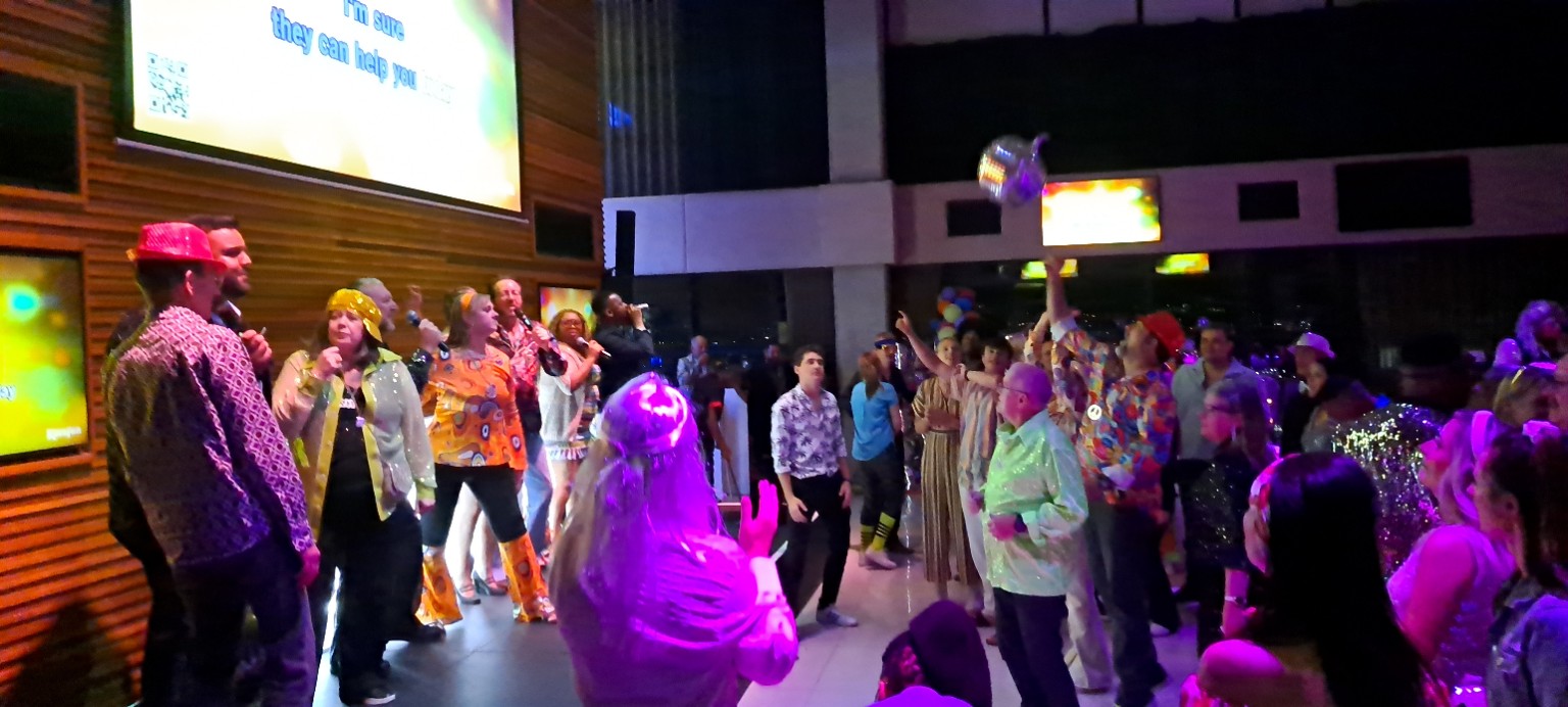 Guests enjoying hosted corporate karaoke with Rhythmic Knights